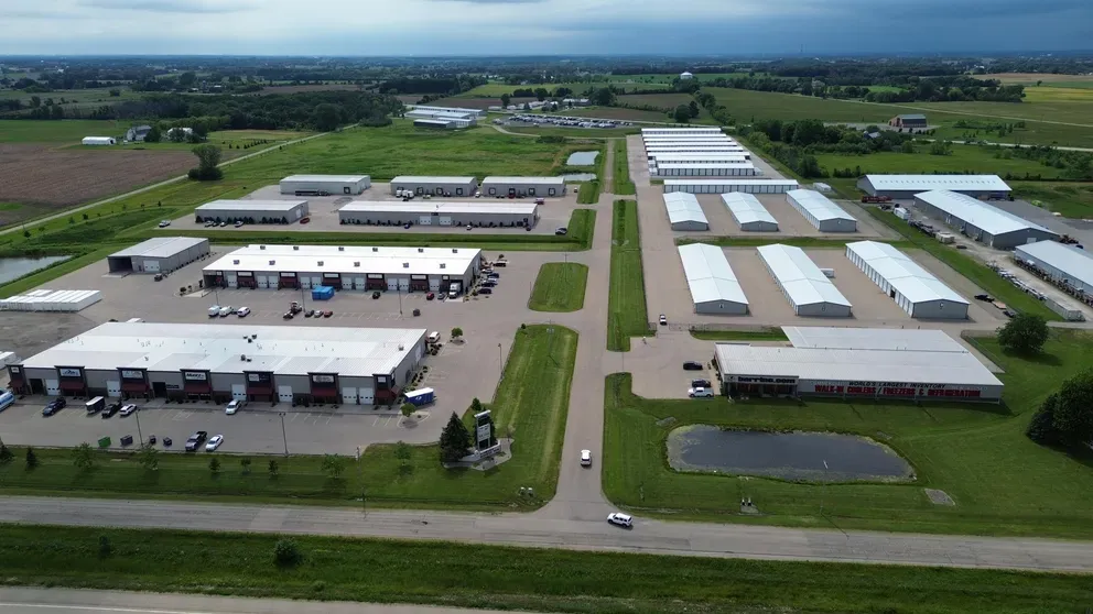 Storage facility ariel view of entrance from road